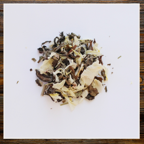 Dry herbs or spices on a white paper with a wooden border | Alaska Beauty Peony Cooperative | Homer, AK